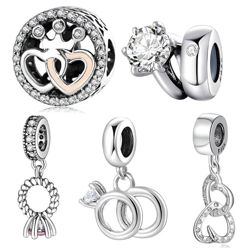 Elegant silver charm set with hearts and rings