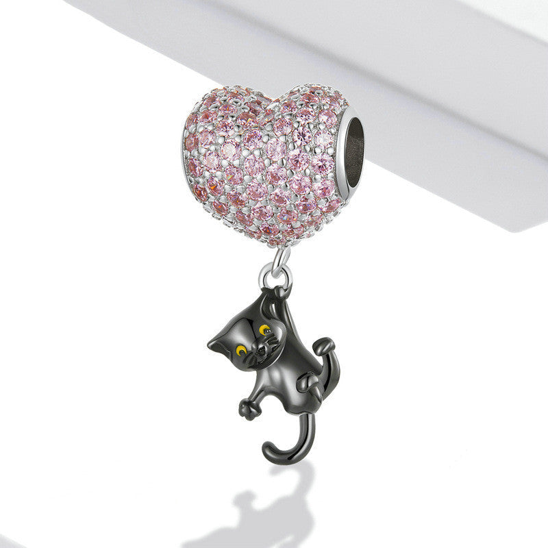 Elegant Cat Heart Charm with a sparkling pink heart and a playful black cat pendant. Ideal for bracelets and cat-themed jewelry collections.