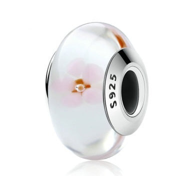 Clear glass bubble charm with pink flower design