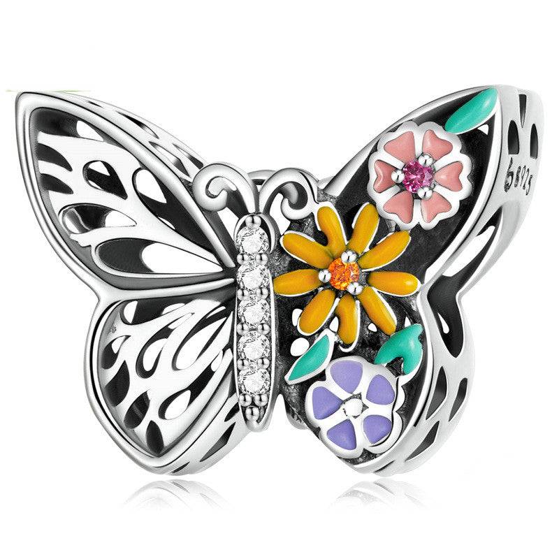 Butterfly charm with colorful flowers