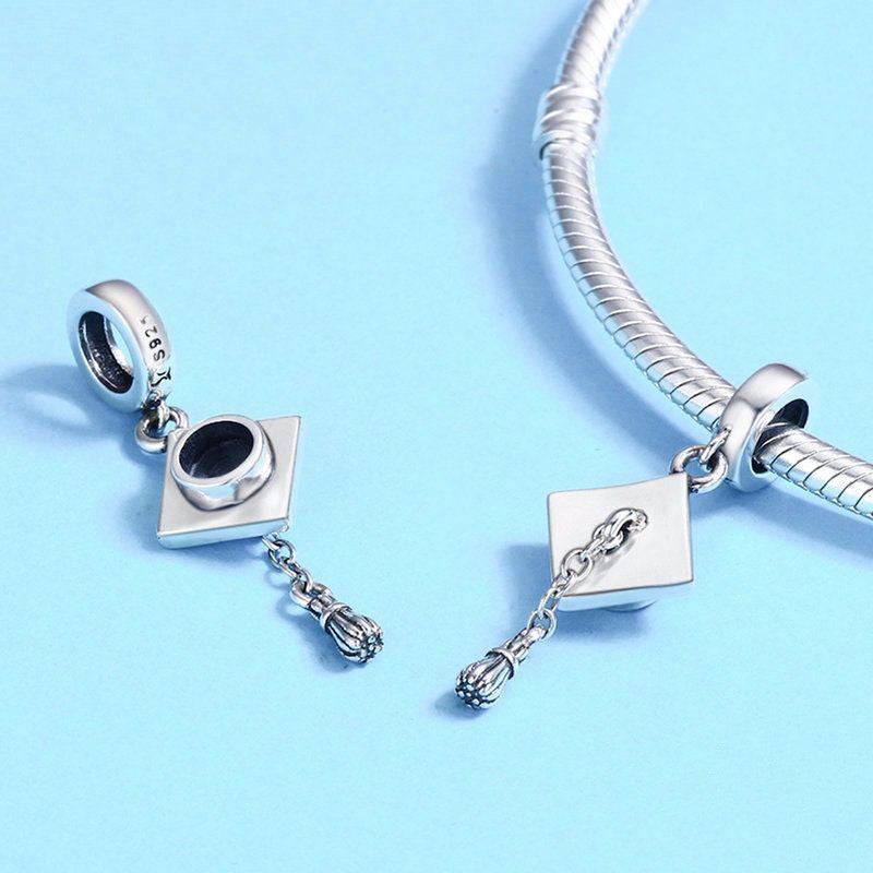 Two silver graduation hat charms on bracelet