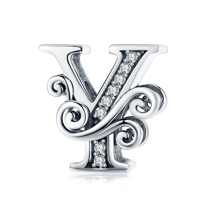 Ornate letter Y charm with swirl design