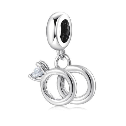 Silver charm with interlocking rings and crystal