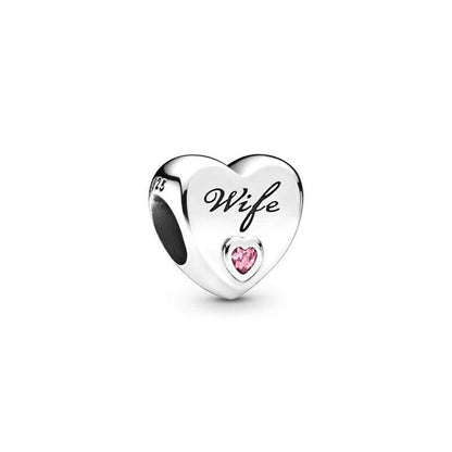 Heart-shaped wife charm with pink gem