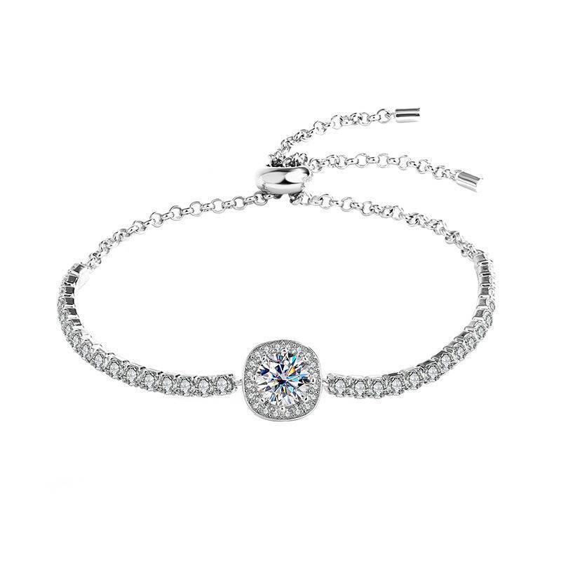 Silver moissanite galaxy bracelet with a clear central stone and adjustable chain, featuring a celestial-inspired design.