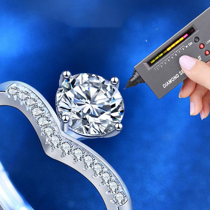 Diamond tester verifying the authenticity of the 1 carat moissanite stone in the Princess Crown Silver Moissanite Ring. Sparkling silver band with accents.