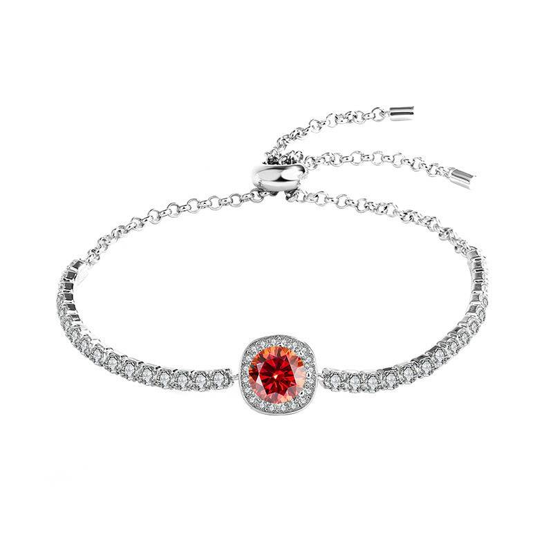 Silver moissanite galaxy bracelet with a red central stone, surrounded by sparkling accents in a celestial design.