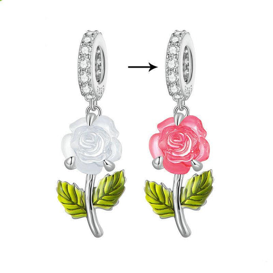 Color-changing rose charm in white and pink