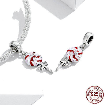 Pair of lollipop charms with red and white swirls