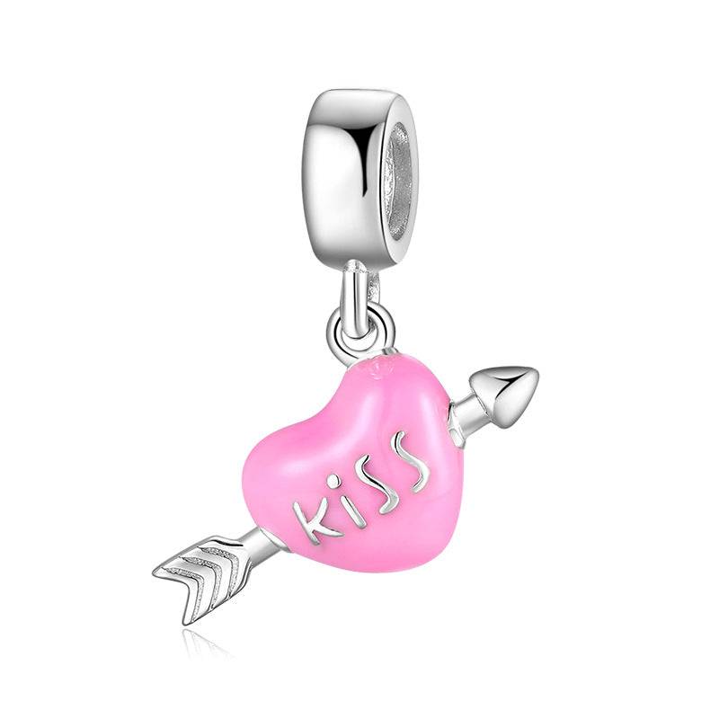 Pink heart charm with 'kiss' and arrow