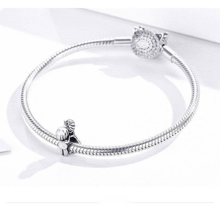 Silver bracelet with couple charm attached