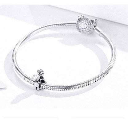 Silver bracelet with couple charm attached