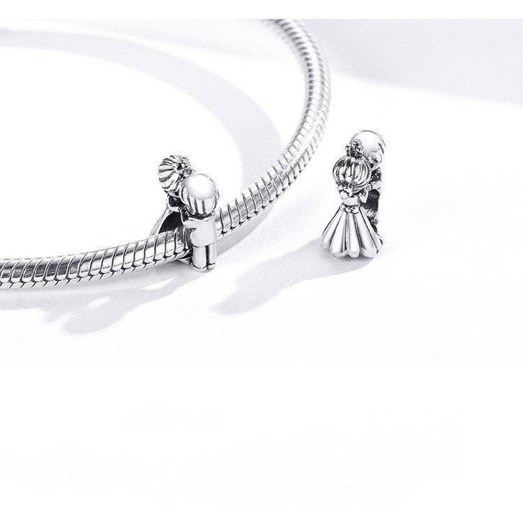 Couple charm on a silver bracelet