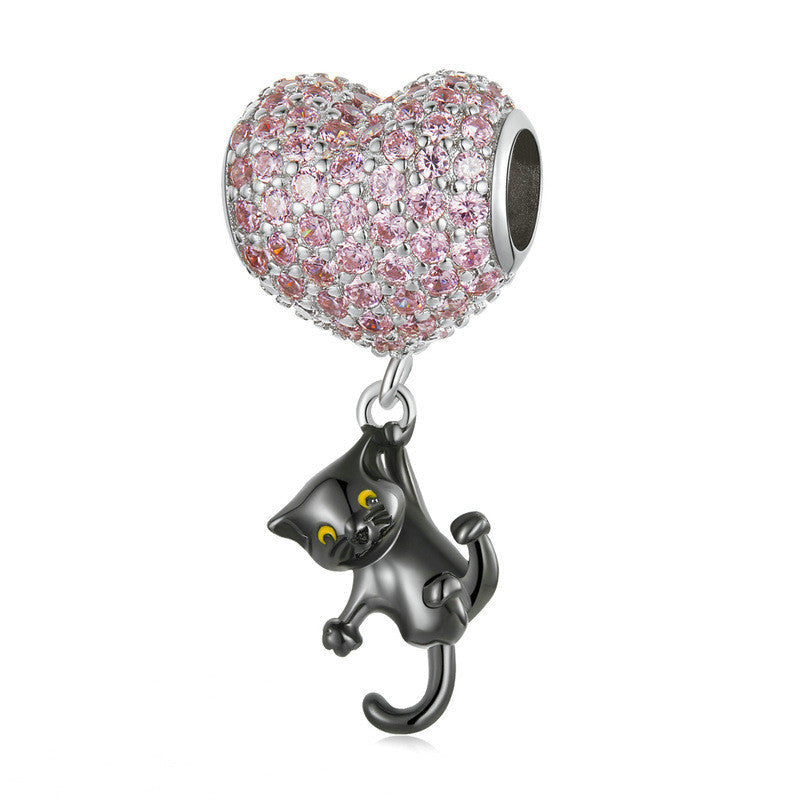 Cat Heart Charm featuring a heart-shaped pink gemstone design with a dangling black cat. A perfect jewelry piece for cat lovers and charm collectors.