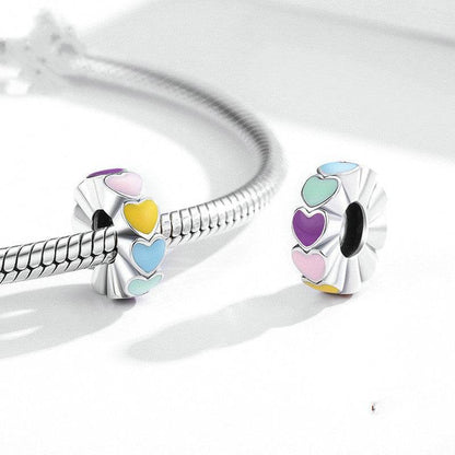 Rainbow heart spacers on a silver bracelet