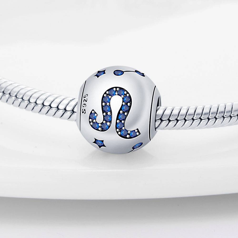 Leo zodiac charm in sterling silver with blue crystal accents, designed for stylish and meaningful jewelry personalization.