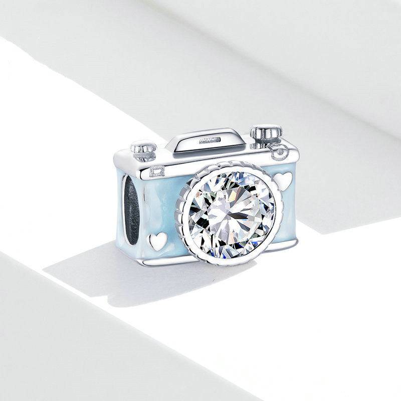 Camera charm with crystal on white background