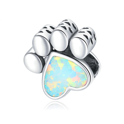 Adorable dog paw charm featuring opal heart