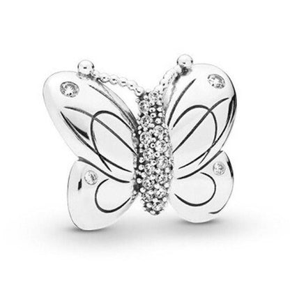 Silver butterfly charm with intricate details