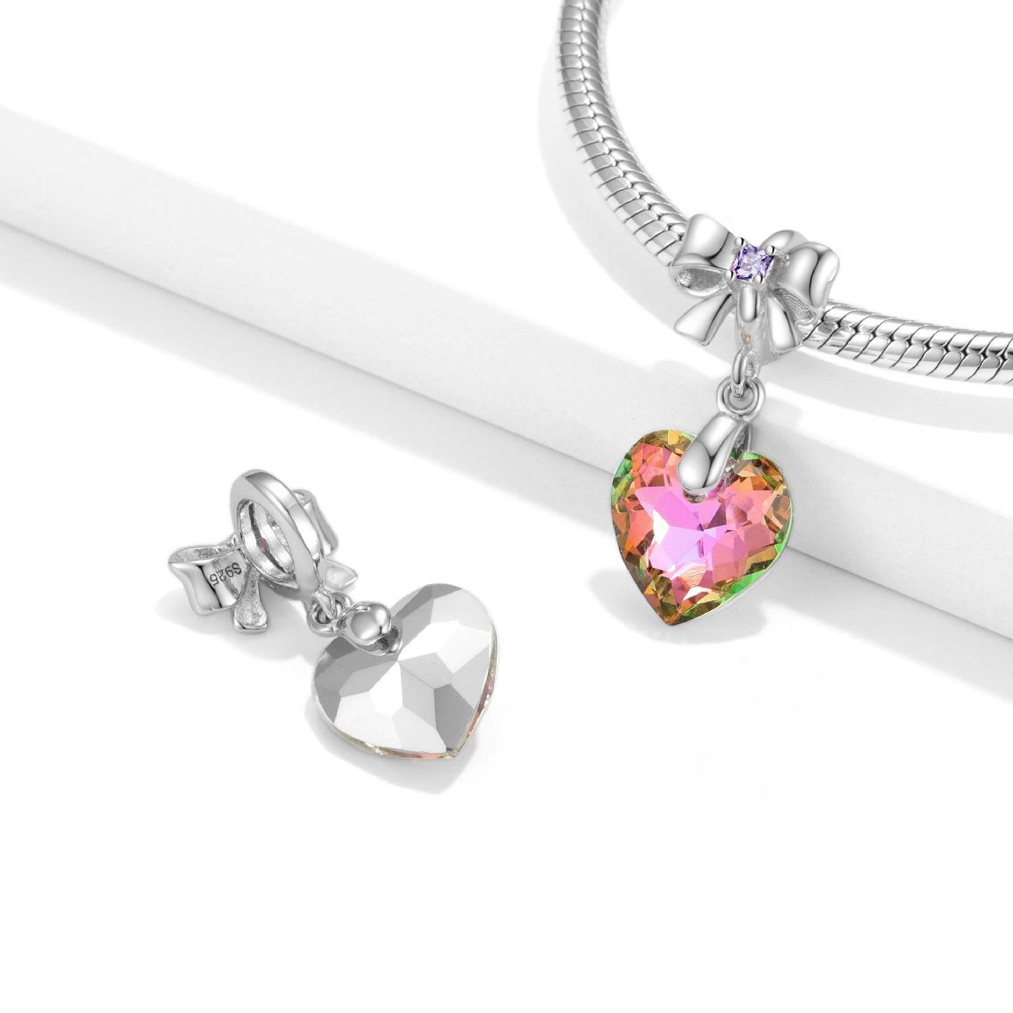 Crystal heart charm on bracelet with silver bow