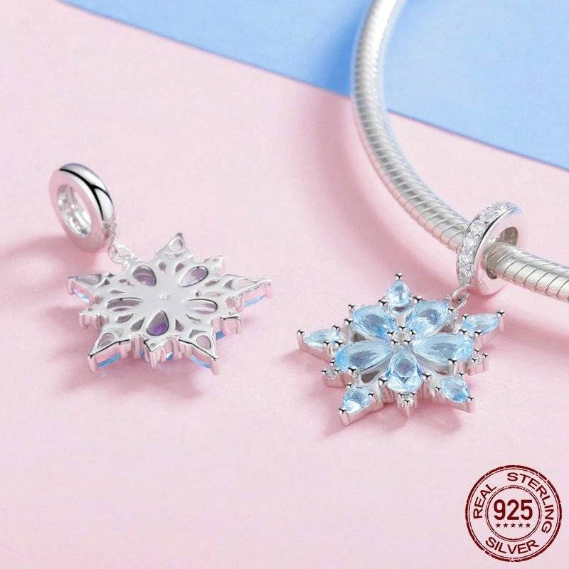 Sterling silver snowflake charms on bracelet